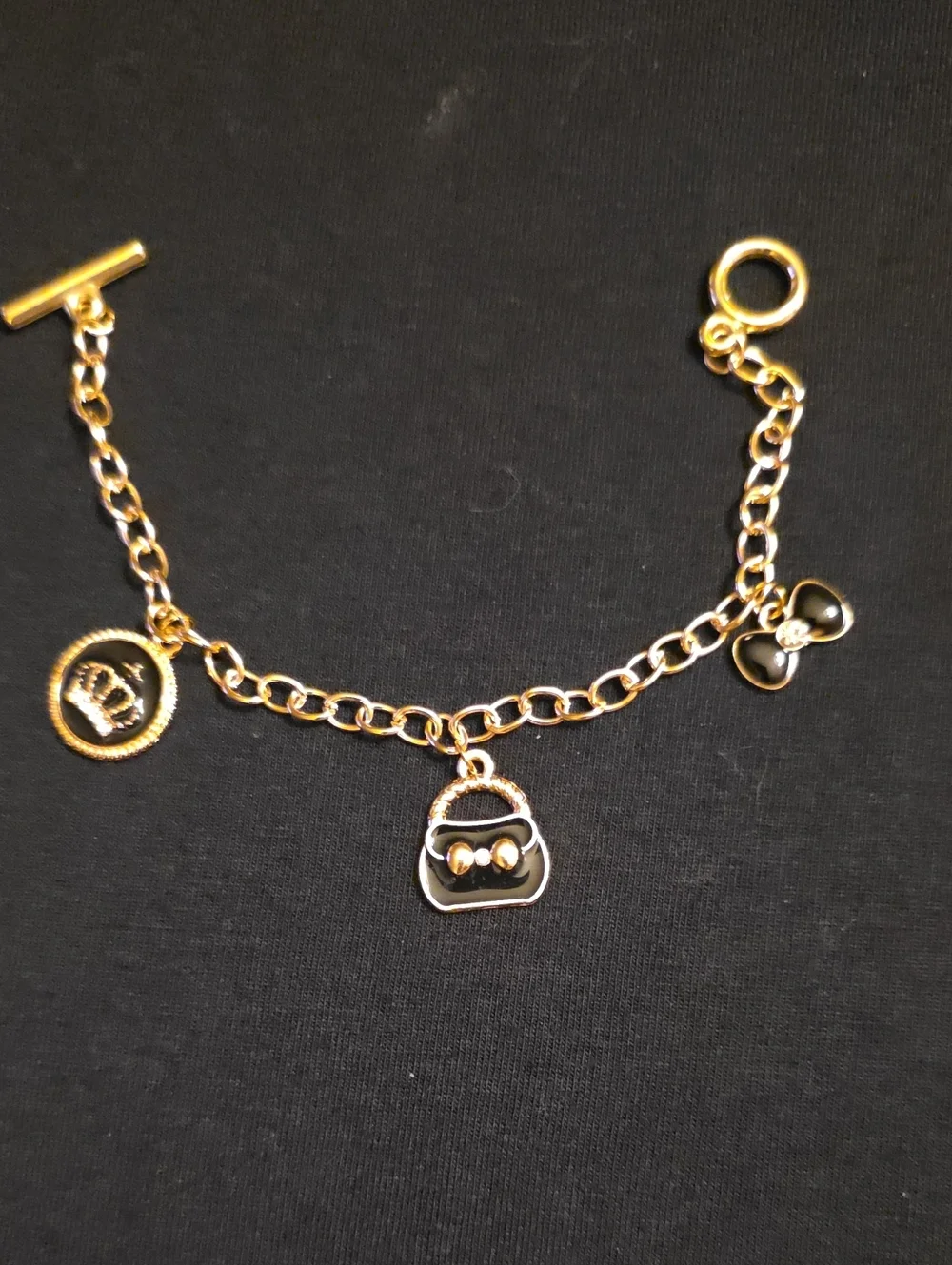 Gold-Tone Charm Bracelet with Purse, Bow and Coin Charms